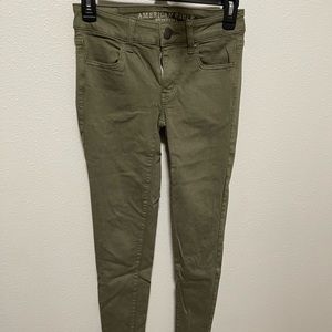 American Eagle green skinny jeans